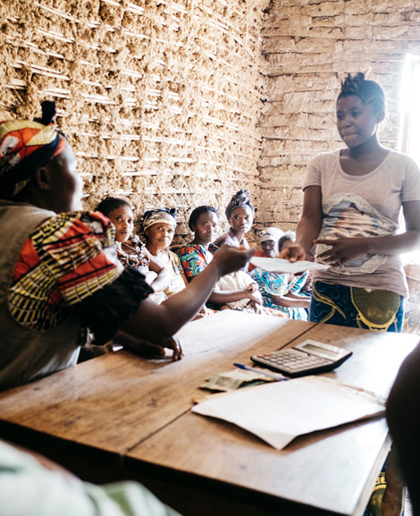 Women in the village of Mavivi, DRC at a micro-finance meeting. 