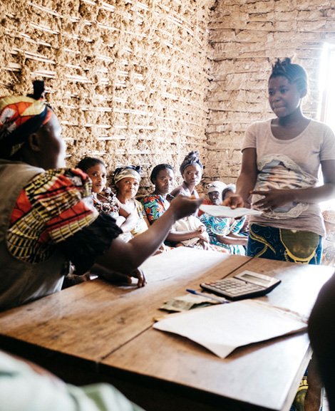 Women in the village of Mavivi, DRC at a micro-finance meeting.
