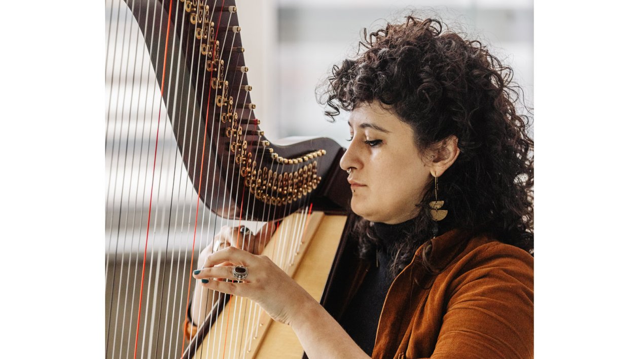 Zainab Lax playing harp