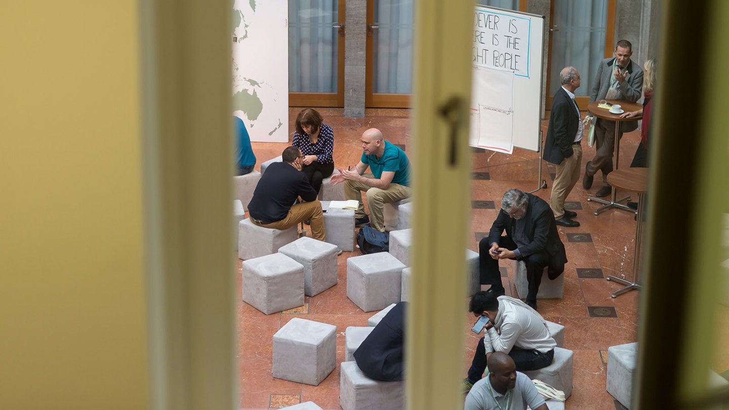 View from outside through the window into the atrium of the Foundation in Berlin