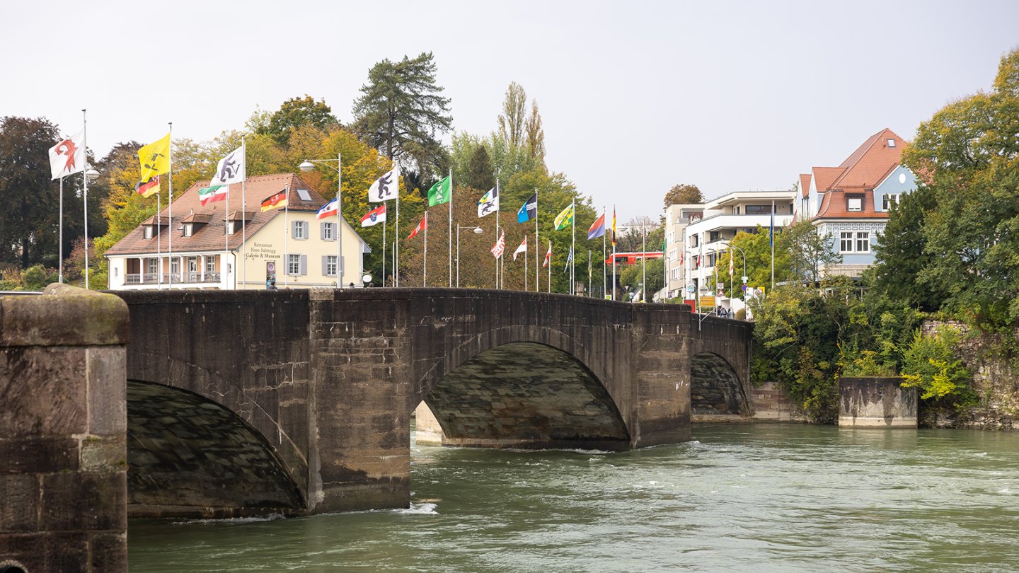 Bridge adorned with numerous flags
