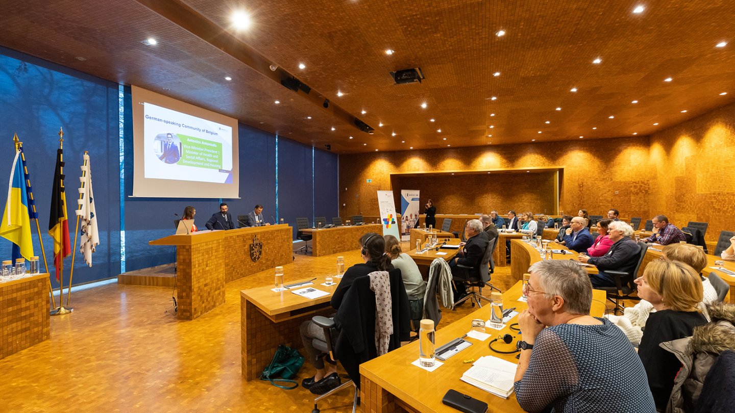 Citizens gathered in an auditorium