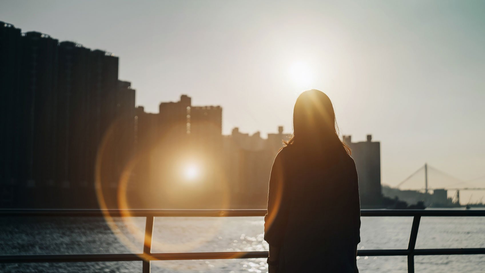 A woman on a bridge.