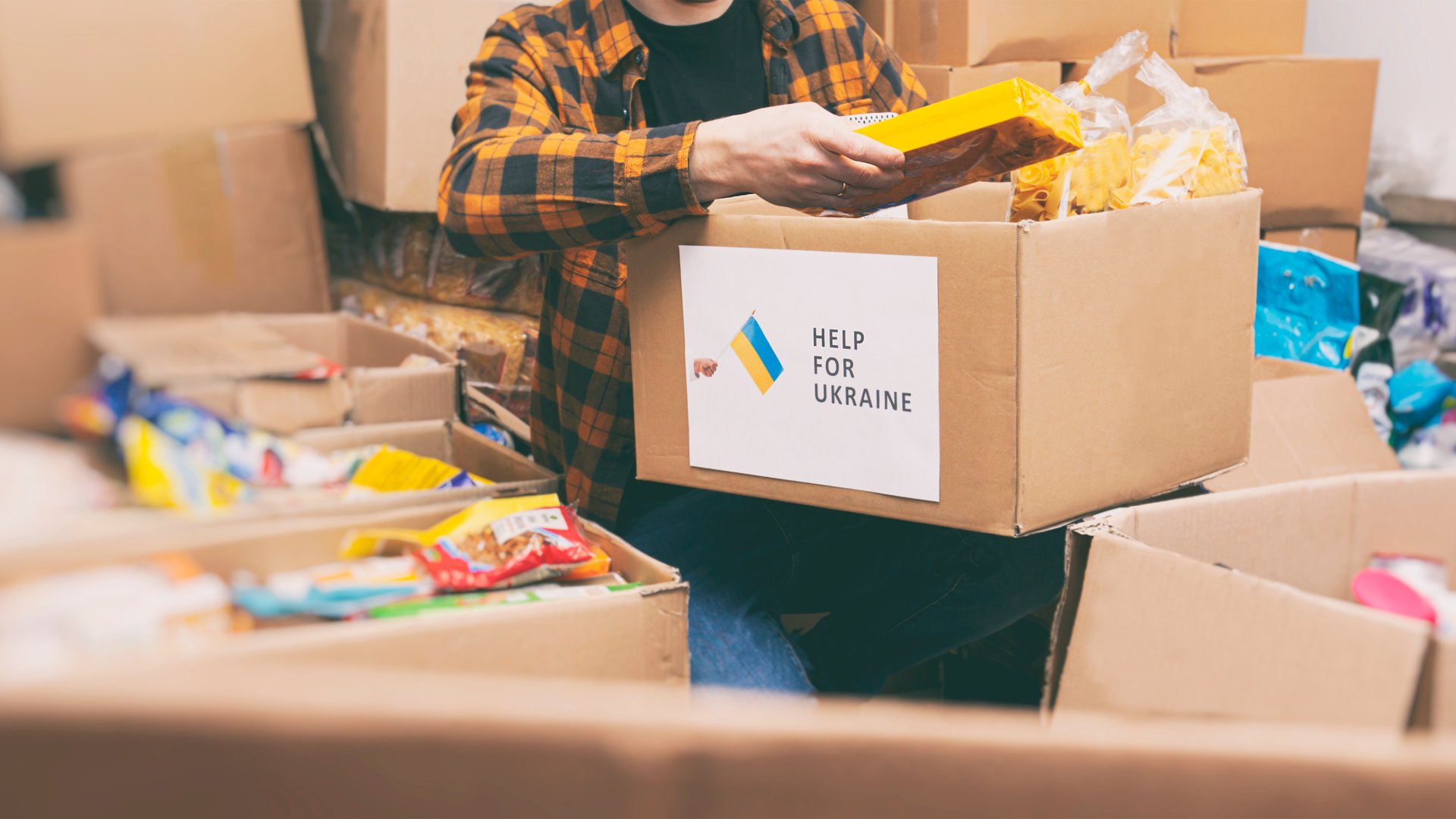 Person unpacks boxes with relief supplies