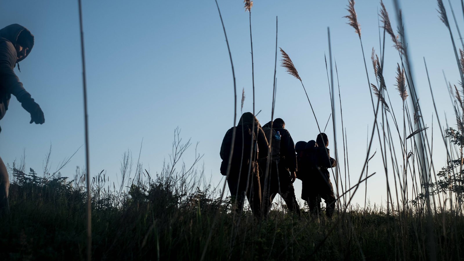 3 Flüchtlinge im Schilf