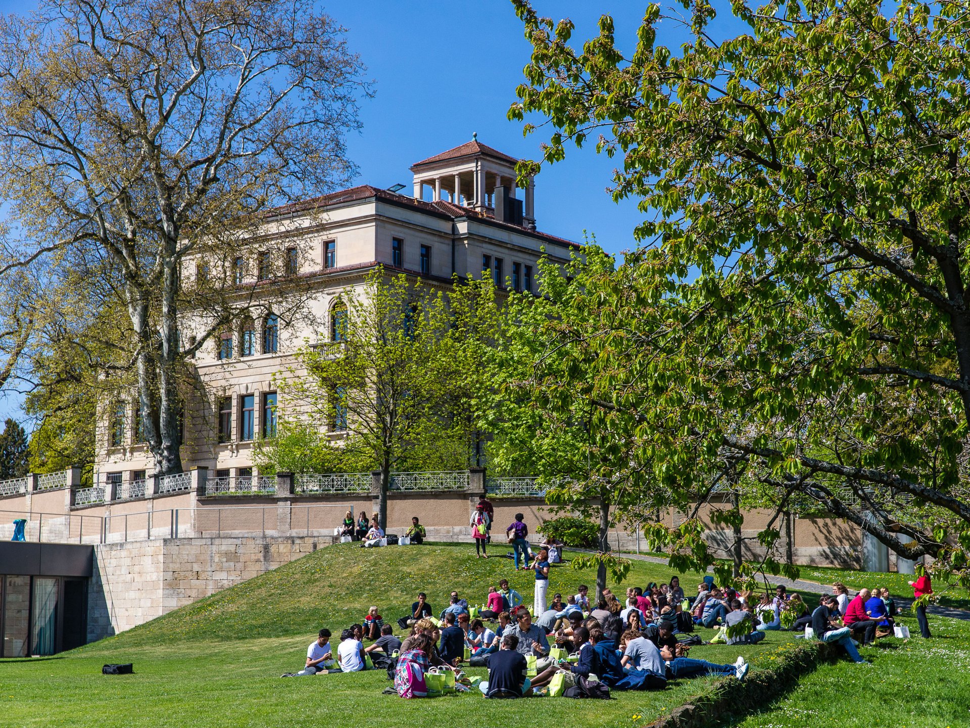 Students from the UWC sit on the lawn in front of Robert Bosch's former house.
