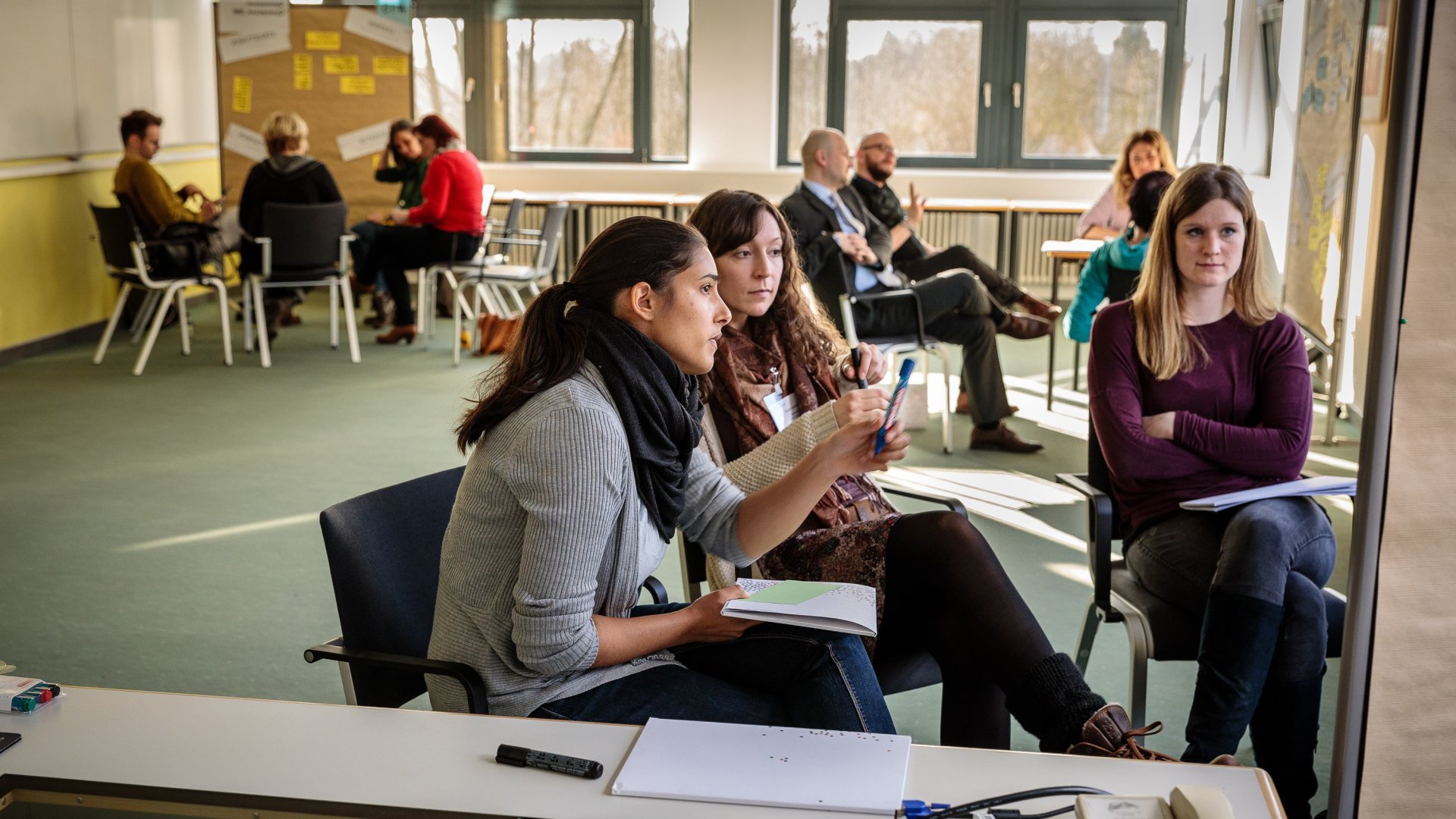 Participants in the job shadowing program discuss at the final meeting