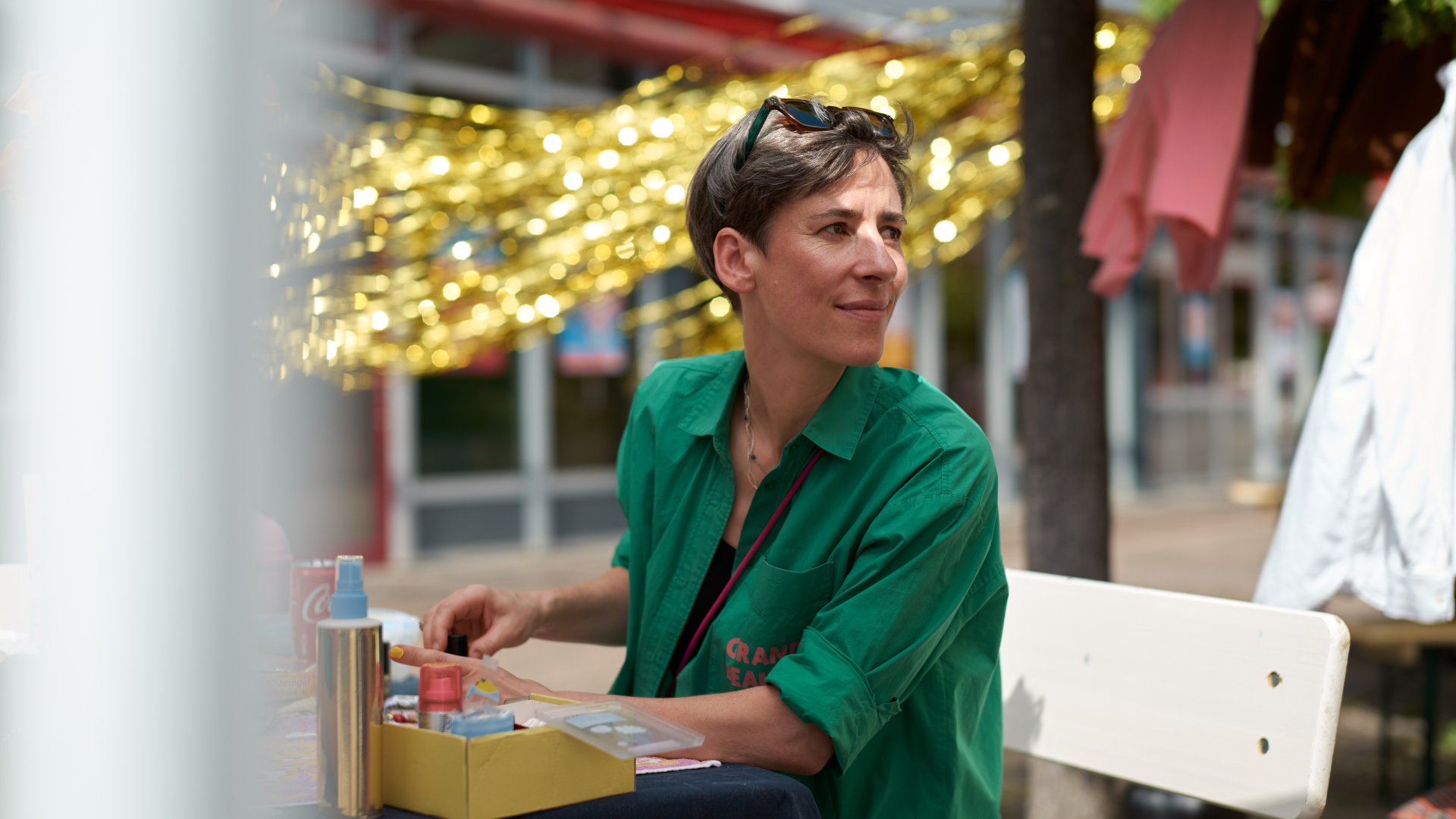 Frauke Frech from Grand Beauty Salon is sitting at an outdoor table.